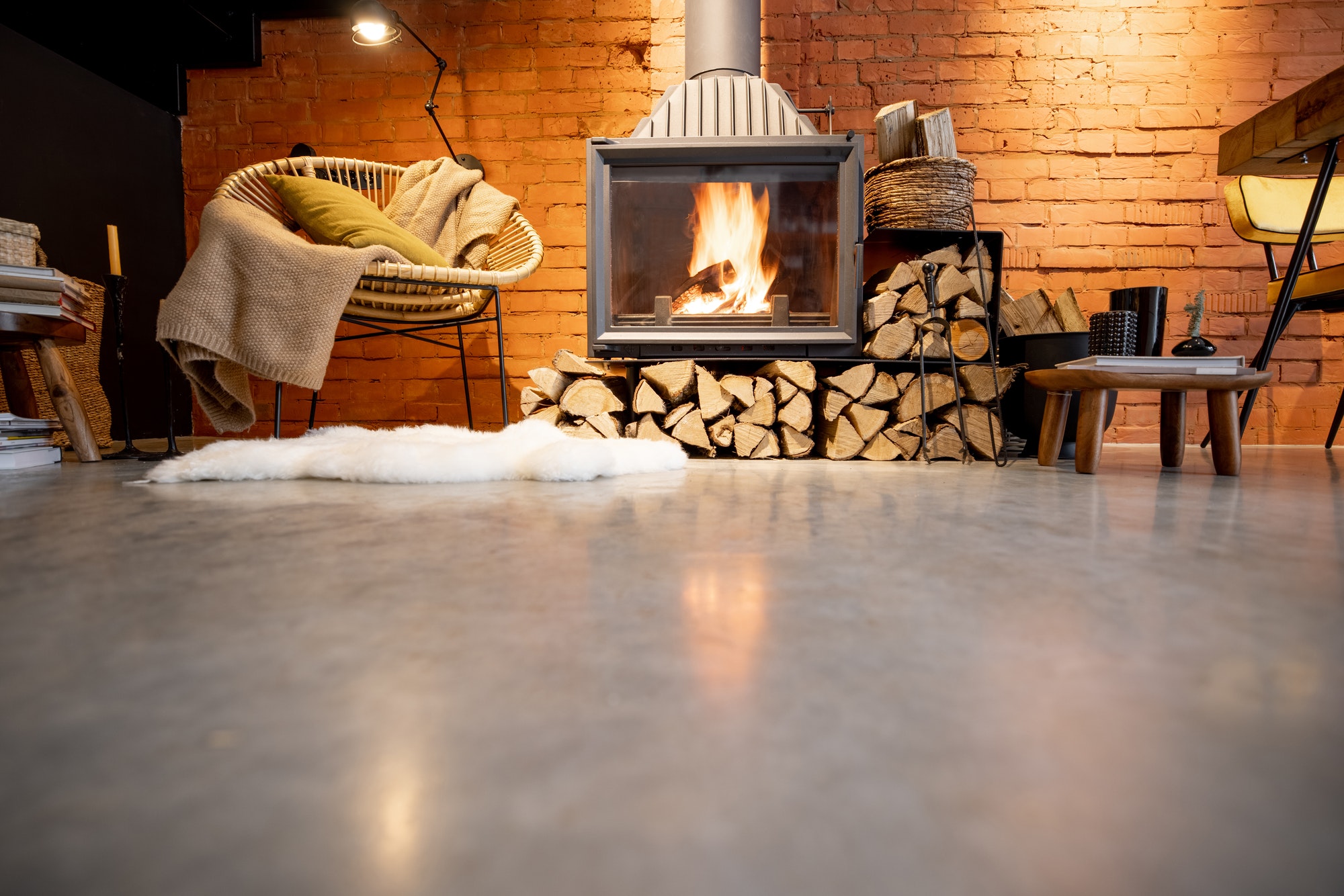 Burning fireplace with firewood at home